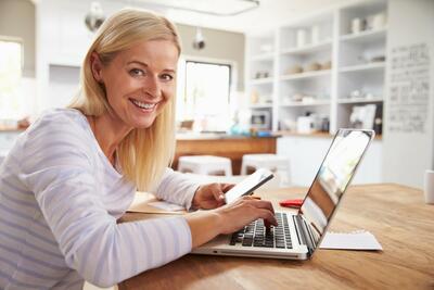 Woman working on laptop at home